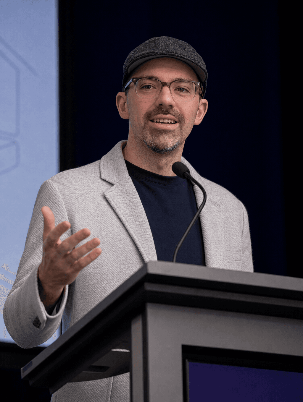 Founder mid-keynote at a podium